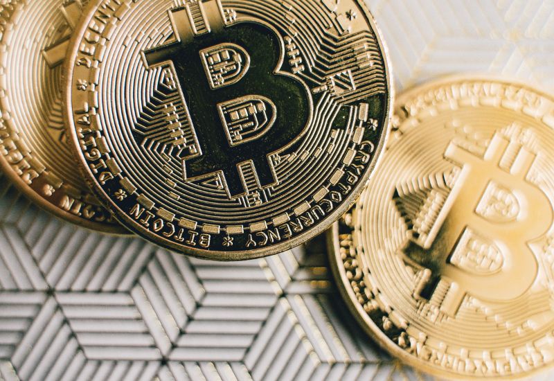 Bitcoins above white background