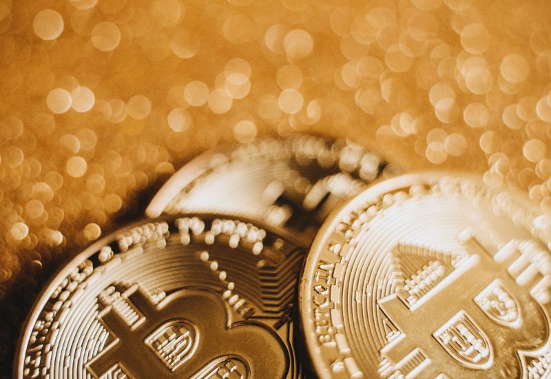 Bitcoins on Orange Background