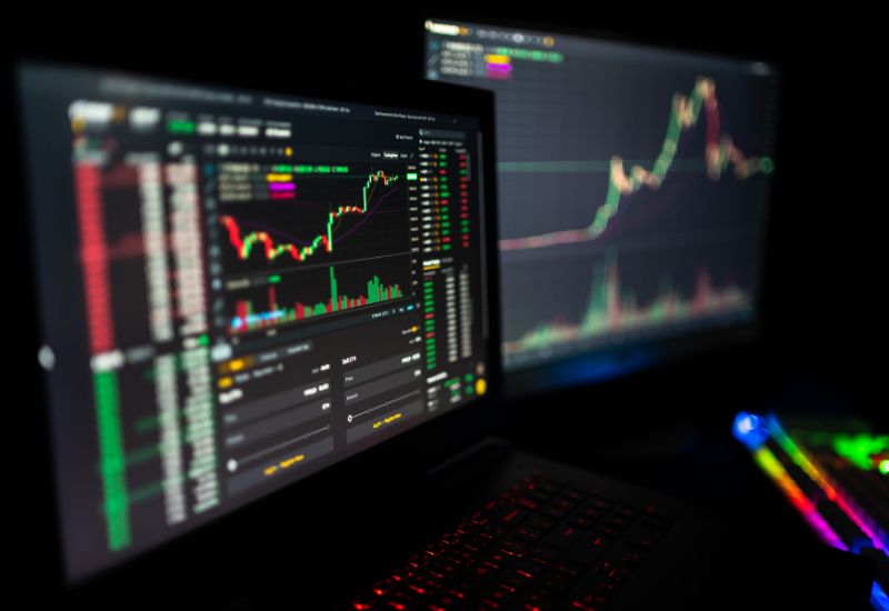 Computer Displays with Crypto Trading Graphics